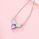 Cargar imagen en la galería, Collar Corazón Rosa Con Moño De Cristal